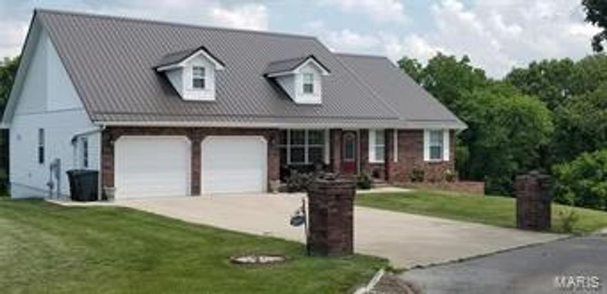 Imagine creating lifelong memories in this beautiful 5 bedroom 4 bathroom home... This impressive home boasts sparkling hardwood floors in the welcoming living room. An impressive master suite large enough for a king size bed and a office,coffered ceilings, a walk in closet, jetted tub, separate shower and double vanities with just enough decorative tile work to make this your special place. The kitchen offers custom cabinetry, a breakfast bar and a dining room perfect for those large dinners. Downstairs is the fully finished walk out basement this home offers porcelain tile in family room area, built in bookshelves that surrounds the fireplace, 3 bedrooms that are tiled as well, 1 full bathroom with a double vanity and a spacious 1/2 bathroom. This home also offers an extra concrete pad on the side of the home currently being used as a basketball court and there is a covered deck. Can you ask for any more? Call to schedule your showings today!!!