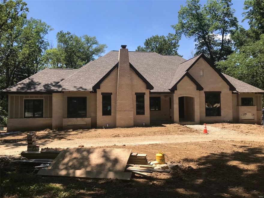 You must see it to believe it! Flower Homes introduces the "Editorial III" Ranch + Plan replete w/exciting new features & innovations. Let me name a few: The vaulted & beamed "Gathering Room" encompassing the Kitchen, Family Rm & Dining Rm w/a wall of glass retractable sliding doors opening to the all-season glass veranda w/vertical retractable doors & phantom screens. The view of the botanical garden in the rear of the private wooded yard is spectacular. A cozy Hearth room steps out to the Morning Porch. The Master Suite offers the "Duet Master Bath" w/private his & her spas. There is a vaulted Study/Living Room off the foyer & a spacious private Studio Suite on the 2nd level; perfect for guest, in laws or family members. Lots of fun to be had in the LL with the Rec Rm, Game Rm, Bar Rm, full Bath & 2nd staircase leading to the 4 car over sized rear entry garage. Custom cabinets, Thermador Appls, Built-in cubbies, Beam Vac, Security & irrigation systems - it's all here waiting for you. Additional Rooms: Mud Room, Sun Room