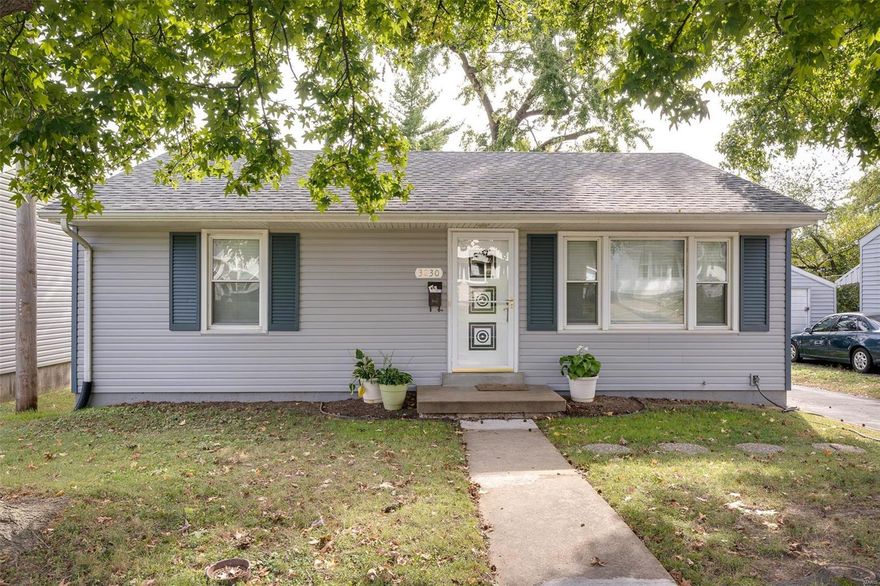 Absolute charmer! Updated and pristine, this cute as can be bungalow style home boasts gorgeous kitchen fully equipped with all appliances including gas range and refrigerator, and featuring tile floors and backsplash. Modern bath with tile tub surround and pedestal sink. Gleaming original hardwood flooring recently refinished and beautiful! Nice sized rooms with ceiling fans with remotes, good closet space. Partially finished lower level would make an awesome theatre room or family room. Big laundry area and washer and dryer are included! Fenced back yard features a storage shed and two nice garden spaces. The roof and siding are newer, and there is a driveway for plenty of offstreet parking. Seldom find homes in such great condition as this beauty! Convenient location and walking distance of park.