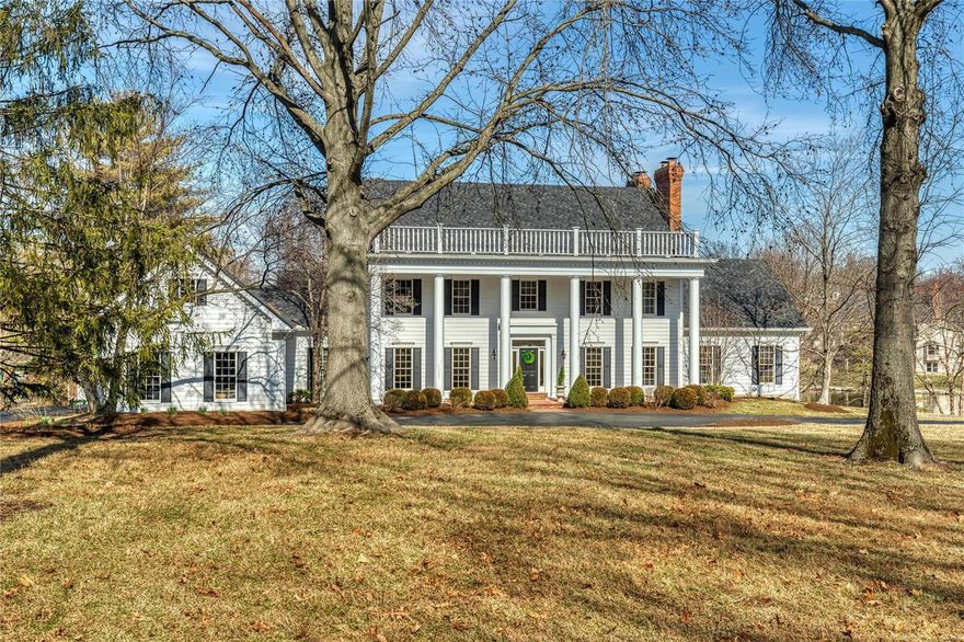 Spectacular lakefront Southern Colonial in beautiful Essex Point. Wide brick porch entrance highlighted by architectural columns leads to impressive 2-sty foyer, formal living room with marble fireplace, elegant dining room and library-paneled family room with wet bar, floor-to-ceiling brick fireplace flanked by built-in bookcases & bank of windows. Designer kitchen featuring granite countertops, white cabinetry, premium appliances & 6’ center island adjoins breakfast room with convenient planning center & sliding glass door that opens to private deck. Coffered master bedroom suite combines the enjoyment of a brick fireplace with His & Hers walk-in closets, luxury bath with jetted tub & adjacent study with wide bay window & built-in bookcases. Front & rear staircases access 4 additional bedrooms & 2 full baths. Walk-out Lower Level includes recreation room with 3rd fireplace & wet bar, game room & full bath. Situated on a premium 1-acre lot with screened porch, 2 decks & 3-car garage.