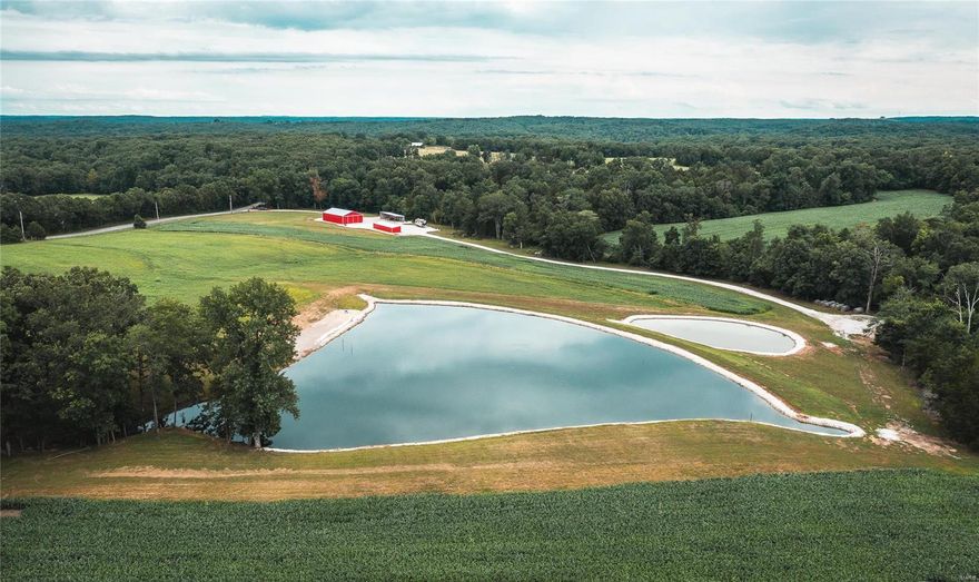 4 Tax Id's make up the 256 acres of this Beautiful Farm. 55 Mins to Downtown St. Louis & 20 mins to St. Clair, Mo. Deer & Turkey Hunt the back of the farm with multiple areas for food plots and trail cams, then be able fish the stocked 1.5 ac pond (15' deep) full of Catfish, bass, bluegill & striper without disturbing the rest of the farm during hunting season. Multiple entrances to the farm for easy access. RV Hook up on site while out there. You have a two wells on the property one for the shop, the other up by the lake. Electric is on the property at the shed and RV Site. Two equipment sheds for your convenience of storing equipment. Tenant Farmer has Milo in this year, Last year was Beans. Beautiful Farm that allows a person that wants to drive a full size vehicle through the farm. This is the place that can allow a Multiple builds and still enjoy the hunting and landscape of the farm.