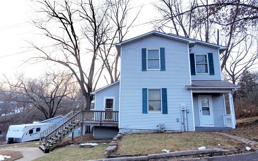 Charming 1 1/2 story home offers 3 br, 2 ba.  This home has a huge kitchen with pantry, lots of cabinets, tile counter tops, separate dining room, living room and main floor laundry.  Huge deck and park like back yard.  2 car garage with electric.