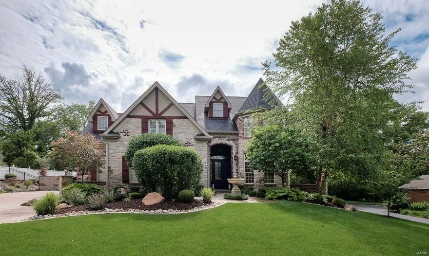 Viewing Begins Tuesday at 10AM "SUPER SHARP" 1.5Sty With All You Can Dream Of! High End Finishes From Top To Bottom And Inside Out..Gunite Pool With Water Feature Surrounded By Paver Decking Leading To Outdoor Living By The Fireplace And The Covered Outdoor Eating Area..Movie Theater..Wine Cellar..Exercise Room..Game Room..Walk-Behind Bar..5 Fireplaces Total..Upper Reading Loft..Upper Play Room/Office..Main Floor Wood Paneled Office..10' Ceiling With 8' Doors On Main Level!! This property is move-in ready with all the work done. The gourmet kitchen features upgraded granite with full backsplash, 6-burner gas Wolf range flanked by decorative corbels and molded hood, built-in refrig, recirculating ice maker, gorgeous cabinetry. Vaulted and beamed hearth room has stone fireplace, newer oversized glass double doors welcome you to the outdoor extensively landscaped paradise. 2-Sty greatroom shows a curved wall of windows and is open to the dining area detailed with stone and wood columns..