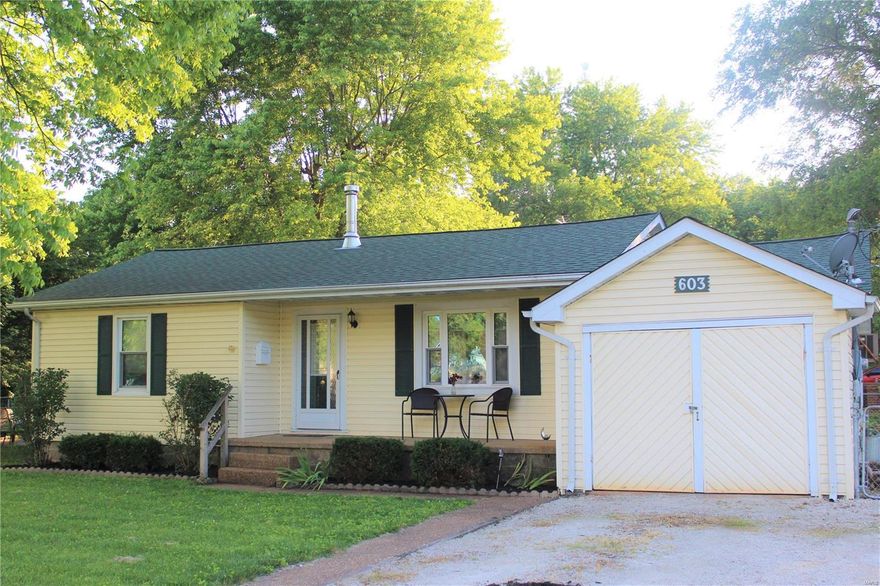 This charming home is perfectly situated on a corner lot with lots of space to entertain. Step inside to enjoy the spacious living room accented by the wood burning fireplace. The updated kitchen offers ample storage, counter space and beautiful colors. Enjoy your coffee in the separate dining room looking out to the large backyard. Two bedrooms and an updated bathroom finish off the interior of the home. The laundry/utility room leads to the oversized garage. Spend the rest of your summer entertaining on the new patio and fenced in level yard. All of these great features are awaiting new owners.