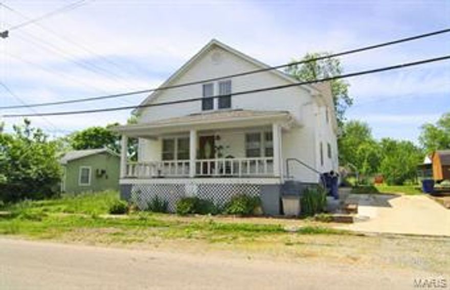 From Curb to Fence all you feel is HOME!!! Original woodwork in large spacious rooms is what you find as you walk into this wonderful home.  Newer Vinyl siding, a large covered patio and fully fenced back yard just begin to set the stage for backyard bar b ques.  The interior has hardwood flooring throughout along with a full basement.  The roof is only 3 year old and all appliances stay with the home.