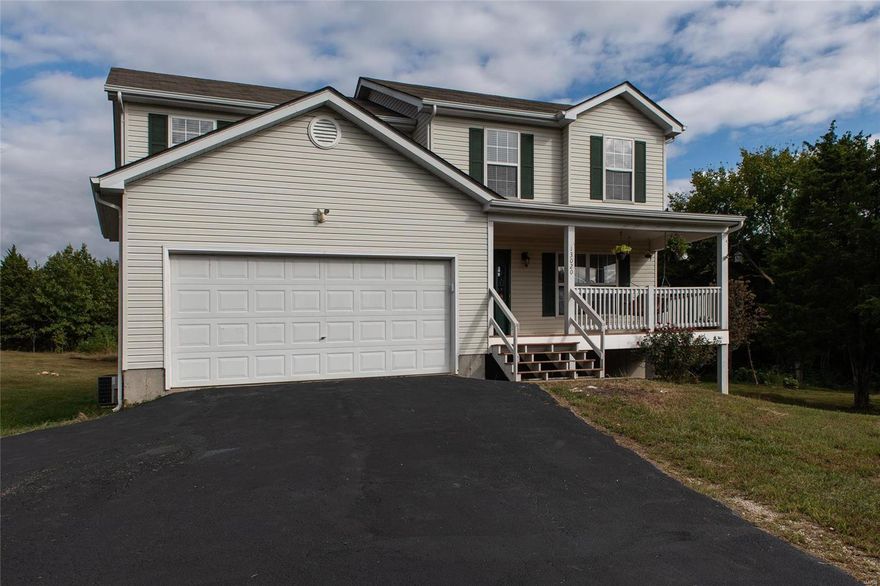 Priced to sell in today's economy.....this 2-story home offers both comfort and seclusion. This home features 3 bedrooms, 2.5 bathrooms, a 2 car garage, and a full walkout basement. This adorable home is situated on a 4 acre lot which you can enjoy from your covered front porch.Home is in a nice subdivision with private drive and yard. Covered front porch to sit and chill or go to back patio and enjoy the privacy of your large level yard. Beautiful hardwood floors and stair case . Some nice sized bedrooms. Walk out unfinished basement with bath rough-in to fix it the way you want. Mostly new doors and flooring thru out home. Play set in back yard for kids or grand kids. Two horses are allowed. If you want comfort and seclusion this is the home for you!