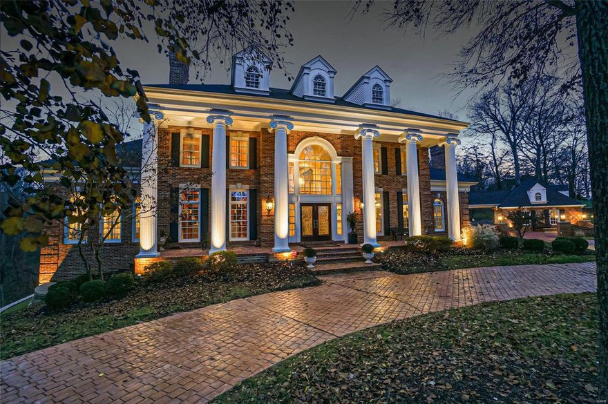 Where luxury and elegance blend seamlessly you’ll find a timeless Wildwood estate. The estate offers a beautiful brick exterior and a brand-new composite deck that extends the length of the home. The main floor primary suite offers his and her closets, a spacious tub, and a steam shower. The kitchen is tailored for a chef with custom cabinetry, high-end stainless-steel appliances, and a large island. The impressive 2-story family room provides breathtaking views of your expansive 3+ acre lot, creating a serene and inviting atmosphere. The finished walk-out lower level adds extra living space, including a large recreational room, wet-bar, double sided fireplace, billiard room, workout room, and a full bathroom. The 3-car attached garage with epoxy floors offers ample space for your favorite cars and storage, along with a 2-car garage connected by a Porte-cochère. The neighborhood street is heated so you can rest easy knowing the winter weather will never be an issue. Additional Rooms: Mud Room