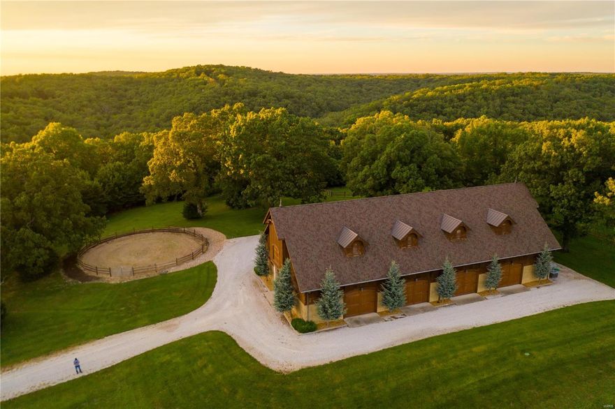 Experience this one of a kind secluded lake retreat with spectacular views, unique amenities, and countless amazing features. River Valley Ranch is a 183+ acre estate located in the heart of the Lake of the Ozarks with ease of access to Osage Beach and Camdenton. This impressive oasis boasts an amazing equestrian center with large living quarters located in the upper level that offers 3 bedrooms, 2 full baths, custom kitchen and great room. With wood floors imported from a tobacco factory, custom cabinets, and granite countertops! If that isn’t enough, you will be in awe as you see the other multi-purpose dwellings, including a 2 bed 1 bath cabin with full kitchen, bunkhouse, oversized garage, massive outbuilding, hay barn, and much more. An unbelievable outdoor paradise that has the infrastructure and features in place to become a wedding venue, lake community, or event center. With so many more features to mention, you have to see this property in person to truly appreciate it!