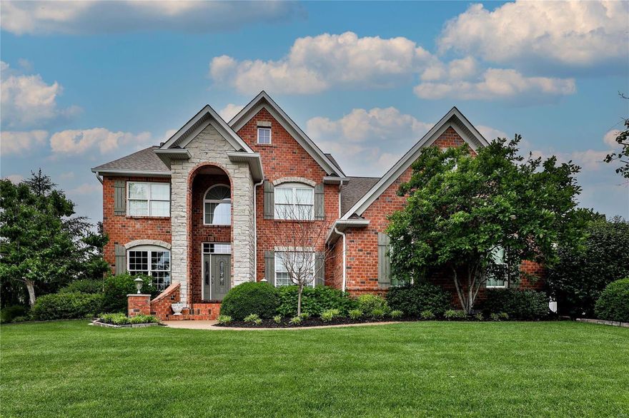 STONE & BRICK front*EXPOSED AGGREGATE DRIVEWAY*4 CAR GRG*Steps to attic storage* dining rm w/WOOD TRIM BUTLER Pantry, COFFERED CEILING*Office wall of BOOK SHELVES,CROWN MOLDING,2 BLADE CEILING FAN*MAIN level 5 1/4" base boards*WOOD floors in kitchen, hearth rm,powder rm*Kitchen tons of 42" cabinets pull outs & soft shut, large walk-in pantry with glass on shelves*9' ceilings on main level & deep pour in LL*SCREENED IN PORCH wood ceiling and wall*Plantation Shutters on main level*Main floor laundry white 42" cabinets for more storage, sink, bead board half way up wall*Back stairs to 2nd level*Master has FRPLC,large custom WALK-IN CLOSET*LL BEAUTIFUL BAR ice maker double sink, dishwasher commercial grade beer cooler*3 PLACES TO WALK OUT to different entertaining areas in yard. WHOLE House Sound System w/exterior speaker*Updated lighting in most of the home*100 amp electrical panel, 200 amp in storag area. Built-in shelves with thermostat direct vent FRPL*BOCCE COURT*SPRINKLER SYSTEM...