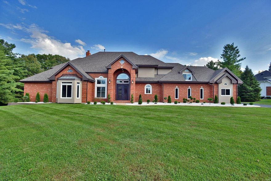 Welcome to the magnificent & astonishing 1 1/2 story, 7,000+- finished square feet of pure luxury & elegance. There is nothing like this home on the market boasting cathedral ceilings, two story foyer & great room featuring beautiful custom trim work wrapped in espresso, hardwood floors throughout gracing you with an extraordinary & unique staircase. The custom kitchen design features kitchen cabinets over 48 inches in height with a modern twist, triple white design cabinets, marble & granite counters, & a white brick pattern backsplash. The elegant black stainless steel appliances & octagon breakfast room are the crown jewel of this home! The Master Bedroom Suite features a woodburning fireplace with a stacked stone surround floor to ceiling. The master bath features a sleek white, black, & gray design with a herringbone floor tile, tiled shower, and custom vanity cabinets! The basement is finished & equipped with a full kitchen, bedroom, living room, entertaining & storage spaces. Additional Rooms: Mud Room