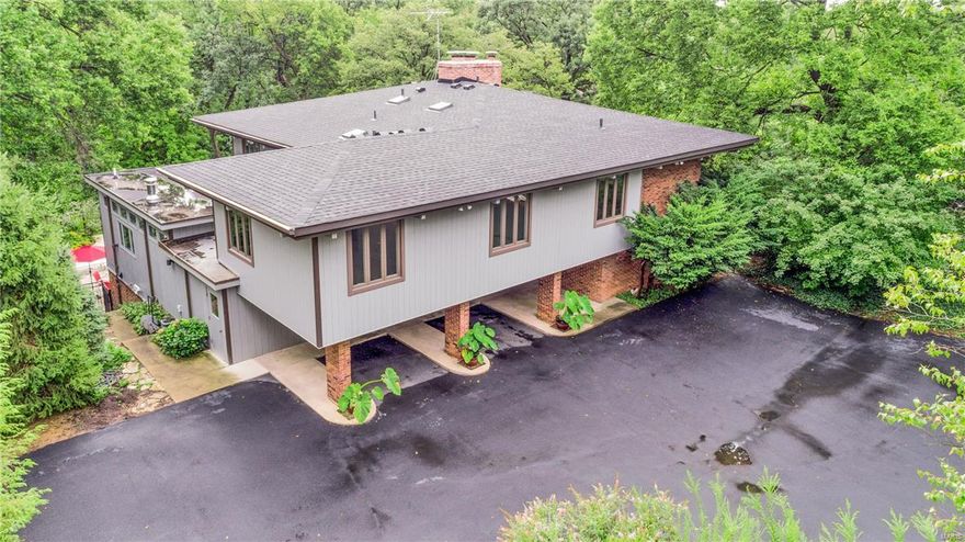 Sophisticated updates enhance this 1963 Monsey House built by esteemed architect Bernoudy. This classic contemporary has 5 bedrooms, 4 full and 2 half baths. It's great room has soaring ceilings, warm fireplace, floor to ceiling windows providing beautiful natural light, and opens to the formal dining room. The main level office is enhanced by a wall of built-in bookcases. An extensive kitchen addition includes granite counters, large center island, high end appliances, and stainless refrigerator. The master suite boasts beautiful master bath with separate shower, jetted tub, sophisticated finishes and large walk in closet. Upstairs there are 4 additional bedrooms & two updated full baths. The lower level's large family-rec room walks out to beautiful in-ground pool. Located on 1.4 acres this home offers privacy with views of the wooded lot & nature. Conveniently located, Ladue schools. Home has new roof, new windows upstairs, new carpet and lower level flooring, pool resurfaced 2017.