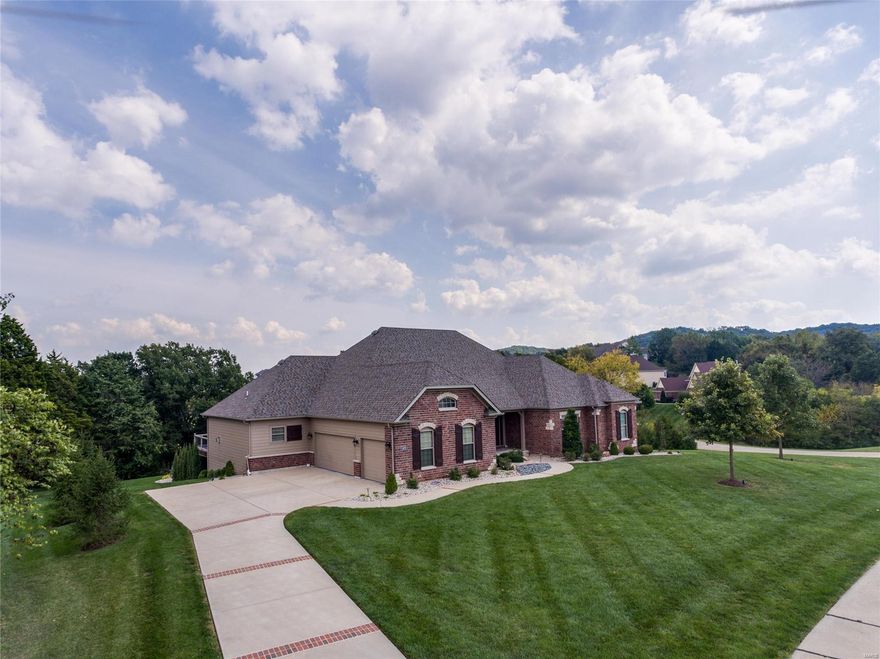 PREPARE TO BE IMPRESSED BY THIS FORMER FISHER & FRITCHEL DISPLAY SITUATED ON PREMIUM 1.34 ACRE LOT IN MANORS OF PEVELY FARMS BACKING TO HOLE #12 & SHORT WALK TO GOLF CLUBHOUSE*YOU WILL BE AMAZED BY THE CUSTOM TAILORED FEATURES W/SPECIAL ATTENTION TO EVERY DETAIL*THE LIST IS ENDLESS & INCLUDES SOARING 11FT CLGS, WALL OF WDWS ON BOTH LEVELS W/VIEW OF POOL BACKING TO TREES*UPGRADED MOHAWK WATERPROOF WD FLRING, INTRICATE MILLWORK,CROWN MLDING & COFFERED CLGS*JUST UNDER 4,000SQ FT OF LIVING SPACE*OFFICE COULD BE 3RD MAIN FLR BDRM BY JUST ADDING WALL*MASTER STE W/REAR VIEW WALL-OF-WDWS, WALK-IN CLOSET & BATH W/GRANITE ADULT HGT DBL VANITY, TUB & WALK-IN SHOWER*EXPANDED HEARTH RM HAS FLR TO CLG STONE GAS F/P*CHEF'S KITCHEN W/GRANITE COUNTERS, SS APPLIANCES & WALK-OUT TO DECK*LOWER LVL HAS 2 WALK-OUTS, BDRM W/FULL BATH, FAM RM & APPROX 2,000SQFT UNFINISHED AREA*NEW 2YR OLD 16X44 HEATED SALT WATER POOL SURROUNDED BY EXTENSIVE PATIO AREA*DUAL HVAC*IRRIG SYSTEM*YOU MUST SEE FULL LIST OF FEATURES!