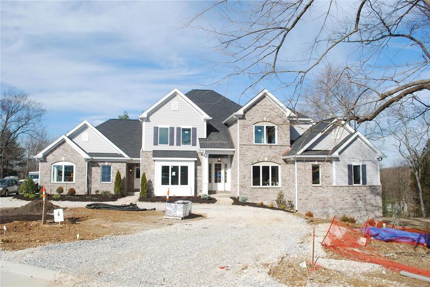 The new custom home at Lot 4, 13761 Stonemont Ct will feature an open floor plan which allows rooms to flow together. The home will be approximately 4,400 sq.ft. Lot 4 Stonemont will be a 1.5 story home in an enclave of 6 new homes on a total of 8.5 acres. The home site is a walk out site with a private back drop and future pool area. The new home features a luxurious master suite on the first floor and three full bedroom suites on the second floor. To enhance the open floor plan the home will have a bright daylighted interior with substantial sized windows throughout. An oversized side entry three car garage allows for additional space. The home site is located in Town & Country off Mason Road just south of Queeny Park. This custom home is a tremendous value that is priced well below new custom homes in Town & Country.