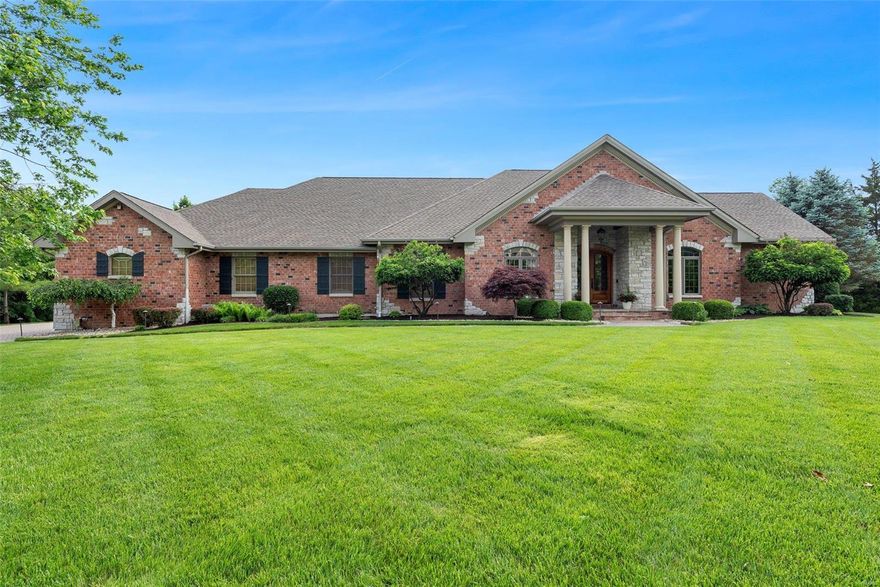 Car collectors dream featuring an 1,947 sq ft garage w/ heated epoxy floor! One of a kind custom built estate! Located on an acre w/ stone paver driveway & brick/stone elevation! As you enter this home you will notice the 10' ceilings, 7" base trim & spacious open floor plan! The kitchen features cherry cabinetry w/crown molding, professional grade Viking, Subzero & Décor appliances, breakfast bar, island & adjoining hearth room w/ stone gas fireplace, built in cabinets, Hickory floor & wooden vaulted ceiling w/ wood beams as well as access to the large covered paver patio complete w/ fireplace, grill & gorgeous view of the koi pond! The great room offers a tray ceiling, gas fireplace, columns w/transom arch windows, new carpet & surround sound. The master suite features his/hers walk in closets & adjoining luxury bath w/ air jet soaker tub & walk in shower! Additional amenities include finished walk out lower level & much more! Be sure to see feature sheet for more details!