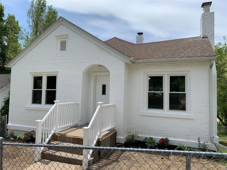 Out of the pages of a magazine this quaint two bedroom one bath home hits the market today.  Every inch has been touched on this property making it move in ready and maintenance free.  Open the front door and be greeted luxury vinyl plank flooring and a wood burning fireplace.  The kitchen has been opened up to the living room, new gas stove, new appliances, new cabinets and countertop.  The deck steps out off of the kitchen. Down the hall there are two bedrooms flanking a bathroom with double sinks. In the basement you will find lots of storage, a one car garage and laundry hook ups. Call to make this house your new home.