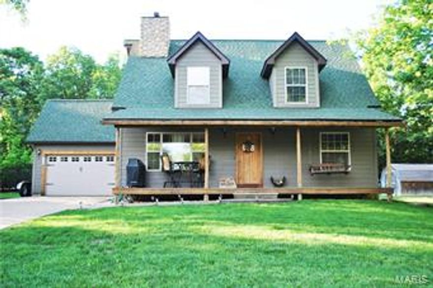 Remarkable country style home overlooking Lake St. Claire! You will absolutely fall in love with this 1.5 sty custom home as soon as you pull up the aggregate driveway. You're evenings will be memorable as you watch the sunset over the lake from a remarkable covered porch. Inside you're greeted by warm wood floors, vaulted ceilings and a massive stone fireplace that extends up the entire wall. Kitchen is spacious and open w/access to a patio. 2 bedrooms on the main level share a updated full bath. Upstairs you'll find a loft area perfect for a home office or play room. 2nd floor master bedroom suite is complimented by 2 closets, gorgeous master bath and plenty of square footage for all of you bedroom furniture. Other benefits include main floor laundry, large level lot, lake view, 2 car garage, custom woodwork, neutral paint, full basement and so much more!