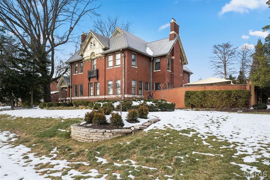 Graciously sited across from Forest Park, this impeccably maintained and thoughtfully updated 1918 Arts & Crafts–inspired residence offers timeless architecture paired with modern luxury. Just steps from Euclid Avenue and minutes from the BJC Medical Complex, the location is as exceptional as the home itself.

A stately entry foyer sets the tone, showcasing exquisite millwork and a dramatic architectural staircase illuminated by a stunning leaded glass window. Formal living and dining rooms provide elegant entertaining spaces, while a sun-filled, south-facing sunroom offers a serene retreat. An informal dining room and classic butler’s pantry connect seamlessly to the updated kitchen, which is equipped with Gaggenau, Miele, Viking, and Sub-Zero appliances, along with a walk-in pantry designed for both function and style.

The second floor features a generous primary suite with an attached sitting room, three additional bedrooms, and two full baths. The third floor is a showstopper—offering a studio or fifth bedroom with two walk-in closets and a luxurious marble bath complete with a steam shower.

Outdoors, the private backyard is a hidden oasis with an English-style formal garden, multiple seating areas, and a tranquil koi pond with water feature—perfect for relaxing or entertaining. A darling treehouse and two car garage complete this historical property.

A rare opportunity to own a distinguished Forest Park–facing home where historic craftsmanship and modern living coexist beautifully.