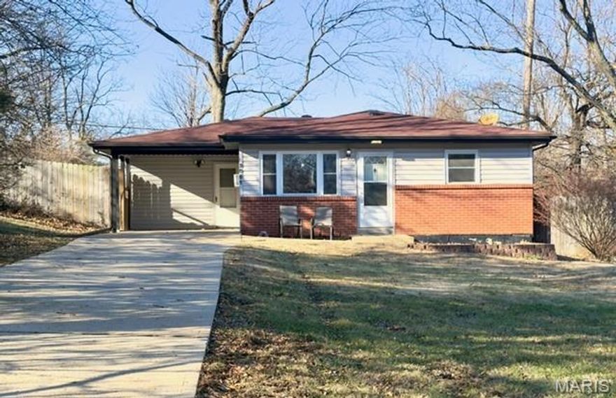 This charming 2 bed/1 bath ranch in the heart of Arnold sits on a spacious .33-acre lot and offers easy, single-level living. Step inside to find a bright living room with laminate floors and a ceiling fan, flowing into a stylish dining area and updated kitchen with engineered wood floors, white cabinetry, and a brick accent wall. Two cozy bedrooms and a full bath with modern vanity and storage complete the layout. The laundry room features a washer/dryer and walkout access. Outside, enjoy a covered carport, large partially fenced yard, modern gutters with leaf guards, and a shed for extra storage. Move-in ready and close to everything! Don't miss out on this one!