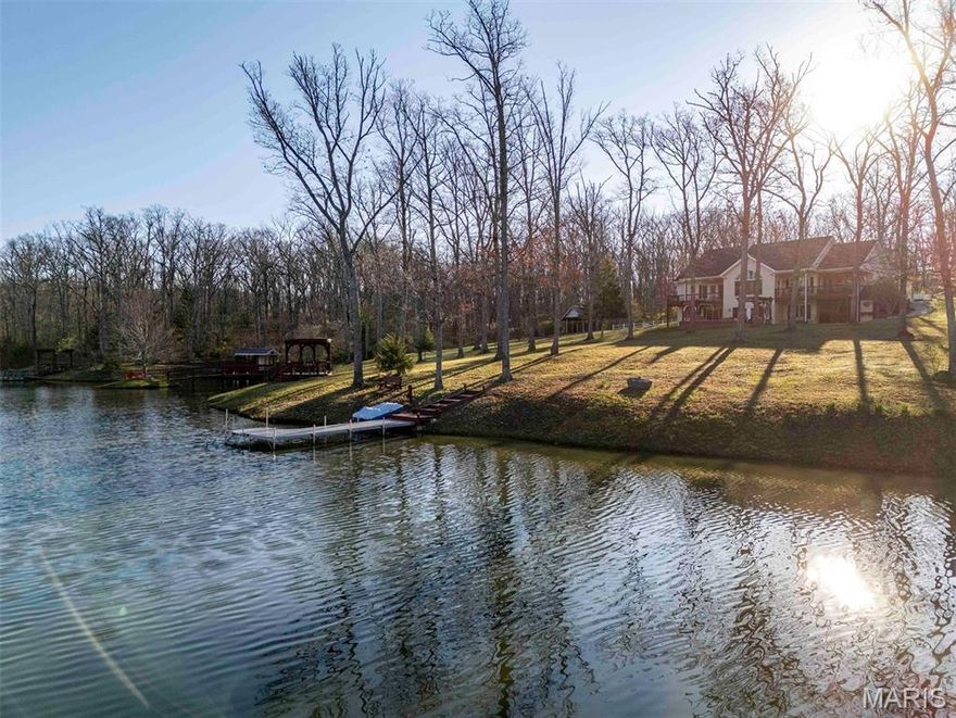 This is the kind of place people try to build for a lifetime but rarely pull off. Rose n’ Oak farm is an incredible 57± acre estate centered around a pristine 3.6-acre private lake and a custom-built home. From the moment you come down the winding private drive, it’s clear this place was built with intention, patience, and a long-term vision.

The 3-bedroom, 2.5-bath homes offer just over 3,700 total living sq ft with 2167 sq ft on the main. It is all laid out in a clean, open concept full of natural light. The kitchen has beautiful wood cabinets, solid-surface counters, and stainless steel appliances, all anchored around a perfectly sized island. For dining, head to the dining room, surrounded by windows, or step right out the French doors onto the covered deck designed for enjoying the view. After dinner, head to the family room. It’s hard to decide what is more impressive: the vaulted ceilings, the stone fireplace, or the massive picture window that captures a full, unobstructed view of the lake. The primary suite is set just off the family room and has its own private covered deck overlooking the water, along with a well-finished private bath featuring a garden tub, separate his-and-her vanities, a large separate shower, and a walk-in closet. All this with a perfectly located office, main floor laundry, and powder room round out the main floor.

The lower walk-out continues to impress with two more bedrooms and a full bath. The large great room really pulls you in, complete with a wood stove, coffered ceilings, built-in bookshelves, and French doors that walk out to the patio. Head into the rec room, built for entertaining, with plenty of space for guests, game nights, or extended stays. Notice the details of the arched doorway and custom recessed lighting over the pool table, craftsmanship at every turn. The home is supported by a brand-new geothermal HVAC system, along with a 17kW backup generator to keep everything running when it matters. Head outside where precision and quality continue. The patio, with two pergolas, a water feature, and a fire pit, creates a space that’s just as usable as the interior and perfect for a quiet evening or to become the go-to host.

The lake is the centerpiece and has been meticulously developed and maintained. Fully stocked, aerated and exceptionally clean, it’s surrounded by a trail system. You’ll find multiple docks and fishing points, thoughtfully placed benches, a pump house and garden, a fishing shack, and a small island. There is a clubhouse on the north shore, perfect for the kids, or turn it into an art studio or rustic guest cabin.

The outbuildings are equally impressive and built with purpose. The 35x50 shop features a full concrete floor, double sliding doors, and a wood stove, making it a year-round workspace. Also, there is an additional 700 sq ft of finished living quarters with top tier finishes throughout, including a full kitchen, bathroom, and bedroom, ideal for guests or extended family. Your equipment will stay out of the rain with the 30’x40’ equipment shed with a lean-to. There are two additional structures set up for sawmill operation and lumber storage. These can be used to store more equipment or purchase the sawmill as well, and mill your own lumber. A large portion of the equipment, including the sawmill, is available for purchase, offering a turnkey opportunity for someone looking to utilize the land in a meaningful way.

The land is a strong mix of oak and hickory timber, along with open ground, offering beauty, privacy, and usability. A new owner could easily set it up for horses or manage it for hunting. A thorough trail system will take you to every corner of the property.

This is not a pieced-together property. It’s a complete, well-executed estate where every improvement was done with care and intention. Private, functional, craftsmanship in every detail, Oaks & Roses was built to be enjoyed for generations. Properties like these take a lifetime to b