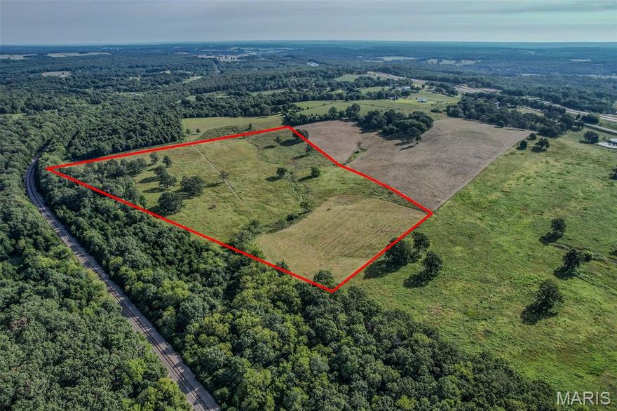 BEAUTIFUL SPOT TO BUILD YOUR DREAM HOME IN A SECLUDED HIDEAWAY! This surveyed 25-acre parcel is located at the end of a long easement lane, & away from the road. offers the opportunity you've been waiting for. Use this blank canvas to build your dream mini farm or home. It is primarily open with some scattered trees in the back. Suitable for hunting. More Land available. Electricy near by.