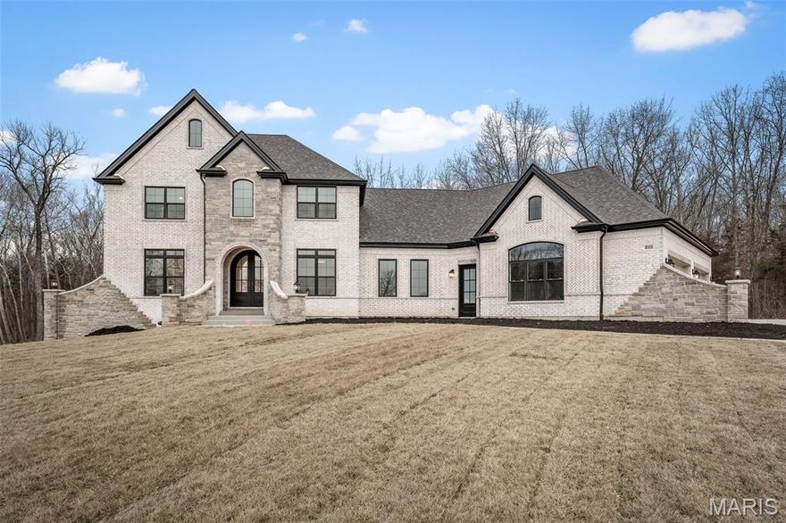 Custom built, 4 bedroom, 4.5 bathroom, story and a half with main floor primary bedroom suite, dedicated study, bonus room, covered patio & oversized 4-car garage. Standard features include a stunning iron front door, a brick & stone front elevation, architectural shingles, irrigation system & landscaping package, 9' foundation pour, high efficiency HVAC, stone fireplace with stone hearth & mantle flanked by built-in book cases, soft close cabinet doors & drawers throughout, custom built & painted range hood, Quartz counter tops, KitchenAid appliances, kitchen backsplash & under cabinet lighting, hardwood floors in main living areas, tile flooring in bathrooms & laundry, tile shower/tub walls, 3 1/4" casing on windows & doors, 6 1/4" tall baseboard, and 3 piece crown molding. UPGRADES: brick wing walls with lighting, brick skirt and sill 3' above top of foundation at side and rear elevations, 10' foundation pour, angled and enlarged garage, enlarged laundry room, pool suite including full bath with access to laundry room, full height quartz backsplash and mitered edge in kitchen, Butler's Pantry, upgraded windows, 8' interior doors on main floor, upgraded closet systems, enlarged front door, 2nd floor laundry closet, pine tongue & groove soffit at rear patio and front porch.