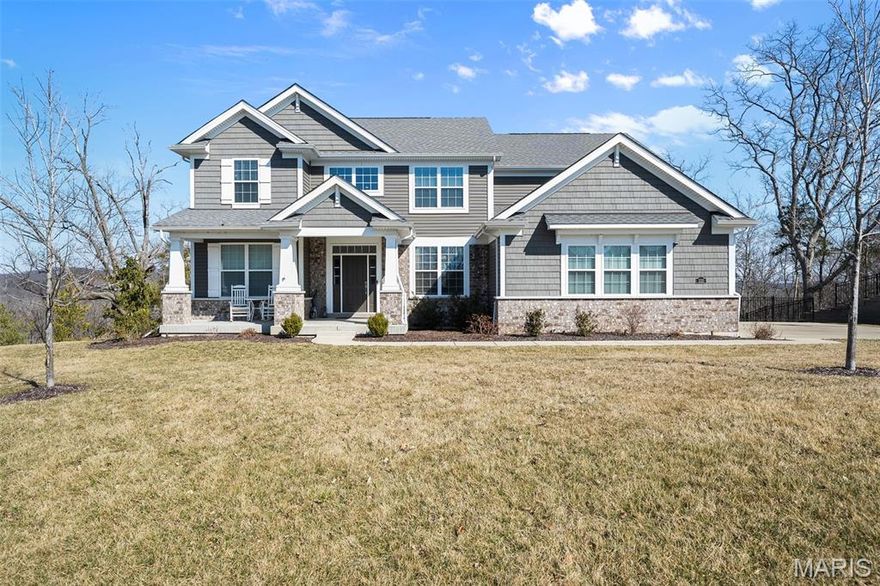 NOW OFFERED UNDER $1M in the highly sought-after Pevely Farms community. Experience the ease of newer custom construction without the wait in this exceptional 4-year-old 1.5-story home, ideally situated within the desirable gated Pevely Farms golf course community. Now offered at an incredible value, this 5-bedroom, 3.5-bath residence delivers 3,766 square feet of refined living space on over an acre of picturesque property.

The main level showcases an impressive vaulted great room anchored by a striking custom floor-to-ceiling fireplace wall, creating both warmth and architectural drama. Just beyond, the chef’s kitchen stuns with 12-foot ceilings, granite countertops, high-end appliances, an expansive 80” x 120” island designed for gathering, and a spacious walk-in pantry. Hardwood flooring flows throughout the primary living areas, enhancing the home’s elevated yet welcoming feel.

Designed for both comfort and convenience, the main-floor primary suite offers a private retreat with a spa-inspired bath featuring a separate soaking tub and shower, along with a custom-designed closet. A fifth bedroom on the main level provides flexibility for a dedicated office or guest space, complemented by a mudroom and additional workspace nook off the garage.

Outdoor living is equally inviting, with a maintenance free deck overlooking a level, fenced backyard that transitions beautifully to wooded privacy. An irrigation system, zoned HVAC, and a 3-car side-entry garage add modern comfort and everyday functionality.

Set within one of the area’s most sought-after communities, surrounded by luxury homes recently selling above $1M, this property represents a rare opportunity to own newer construction with high-end finishes in Pevely Farms at a compelling value.