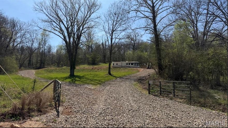 Check out this really nice 3.4 +/- acre parcel with public water, 1,000 gallon concrete septic, and electric installed! This property was setup to be a great spot to build a dream home and the seller is only offering it with a 2002 Winnebago Adventure RV with 38,000 original miles! You could live in the RV while you build or just live in the RV part or full time and travel in it! Property also has a nice patio area with a beautiful view! This property is just down the road from Current River (this property is up out of flood zone)  and just outside the city limits of Doniphan. Please have financing in order before requesting a showing (will need to be cash or conventional).