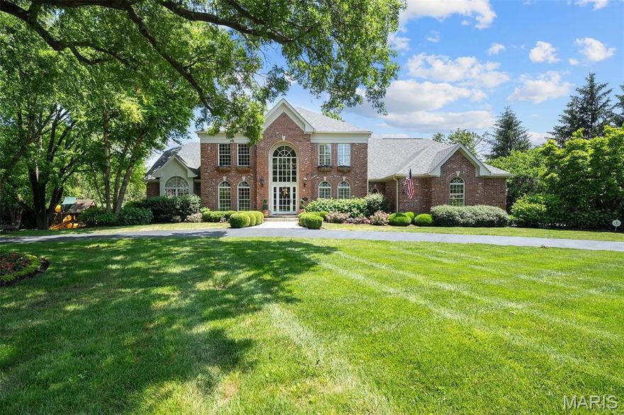 If you're seeking a newer home w/ timeless character & custom details, this is the one! Designed by the well-known Sonja Willman, this residence showcases striking design elements & distinctive details throughout. The grand foyer welcomes you w/ a stunning circular staircase & opens to a richly wood-paneled office. The 2 story great rm is flooded w/ natural light & features a dramatic stone fireplace, wet bar, & hand-carved wood beams. The heart of the home is the unique 2 story gourmet kitchen—custom designed w/ style & functionality in mind. It flows seamlessly into a vaulted hearth rm w/ its own cozy fireplace, perfect for gathering. Nearby, you'll find a main floor wine cellar—ideally located between the kitchen & formal dining rm for easy entertaining. One of the standout features is the expansive screened-in porch, offering serene views of the private & beautiful backyard oasis, pool & waterfall. The luxurious main-floor primary suite boasts vaulted ceilings w/ hand carved beams. The spa-inspired primary bath includes separate “his & hers” vanities & closets, a soaking tub, & a steam shower. Upstairs, you'll find 4 spacious bedrooms & 3 full baths. The walkout LL is an entertainer’s dream w/ a large recreation area, workout rm, newly finished bedroom & bath. Plus, a charming treehouse! Step outside to the putting green to perfect your short game. Additional features include a circular driveway, 3 car garage, professional landscaping & high-end finishes throughout.
