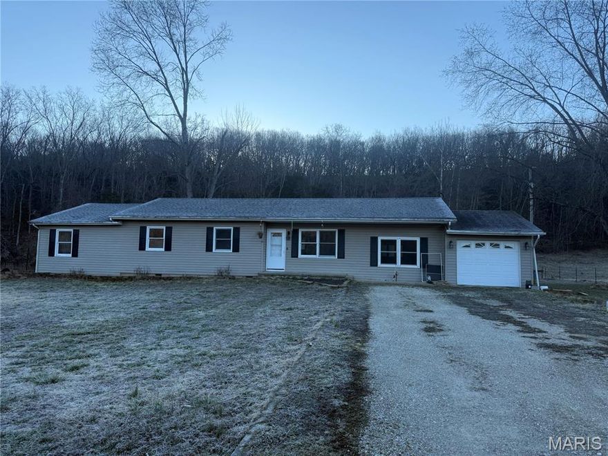Located in a peaceful setting within the Waynesville School District, this beautiful 4-bedroom, 2-bathroom home sits on a spacious 1-acre lot, offering the perfect blend of privacy and comfort.  Inside, you’ll find a cozy wood-burning fireplace/stove that creates a warm and inviting atmosphere. The eat-in kitchen flows seamlessly to the back deck, making it ideal for entertaining or enjoying quiet evenings outdoors. Step outside to a huge backyard with plenty of space for gatherings, gardening, or simply relaxing.  The generously sized master bedroom features direct access to the backyard, providing a private retreat with easy outdoor access.  This property combines peaceful living with convenience — a wonderful place to call home!