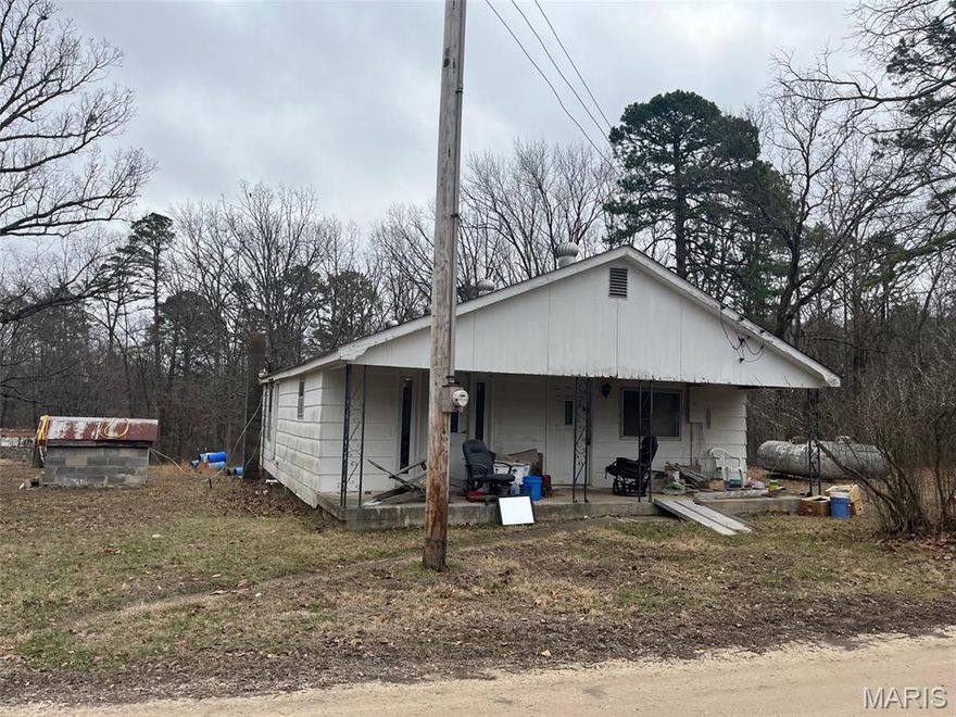 Looking for a fixer upper? Or maybe build a home or put a manufactured home on the adjoining land? Here you go. This home features a 3 bedroom, 1 bath, partial basement, barn, and has 2 parcels of land. Home is on 2.8 acres and  5 acres that adjoins.  The seller has no knowledge regarding the mobile home on the property. Selling As Is. Check this one out!