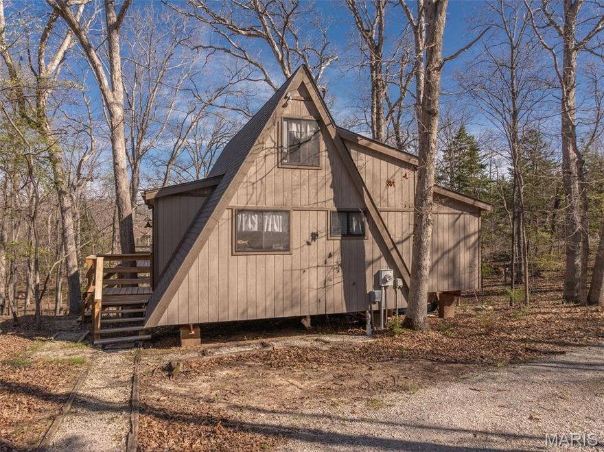 This classic styled A-frame chalet is tucked among the trees, offering a peaceful retreat for weekends or extended stays. It sits on a hard-to-find level lot and the horseshoe driveway makes parking and access easy. The main level features a spacious primary suite with its own private deck. It’s a great spot for morning coffee or a quiet evening outdoors. A larger deck extends off the living room and gives you plenty of space to grill, dine, and gather. Inside, the vaulted ceilings create an open feel. Large windows bring in natural light and frame views of the surrounding oak forest. The loft upstairs adds flexible space. It works well for extra sleeping areas, a home office, or a casual hangout. Community sewer allows for the convenience of a washer and dryer as well as a dishwasher. High-speed internet is available. Stream away! Paddleboards and a kayak are negotiable. The location is fantastic. Close to Lake Aspen’s swim beaches, the golf course, and the clubhouse for dining and socializing. This property offers the flexibility to be rented, giving you the option to offset ownership costs or generate additional income when you’re not using it. It’s a great way to maximize the value of your investment while still enjoying the home yourself. Note, this is designated as a second-home property and is not permitted for full-time, primary residency. Plenty of time to get in and enjoy all that Innsbrook has to offer!!
