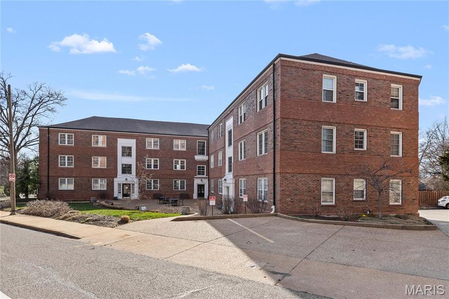 Charming Main Floor Condo at Davis Place In the heart of Clayton. This one bedroom unit is loaded with classic style. The large living room features newer flooring and lots of natural light, and is open to the kitchen with Modern, Updated Cabinetry, solid surface countertops, stainless steel appliances, breakfast bar, and attached dining area. Down the hall is the large bedroom and full bathroom. Multiple closets throughout. Secure entry. Beautiful community patio/courtyard area for entertaining and visiting with neighbors. Community Laundry area in basement with the ability to add an in-unit laundry. One assigned parking space and storage unit in lower-level garage. Walk to shopping, dining, nightlife, and ALL that Downtown Clayton has to offer.