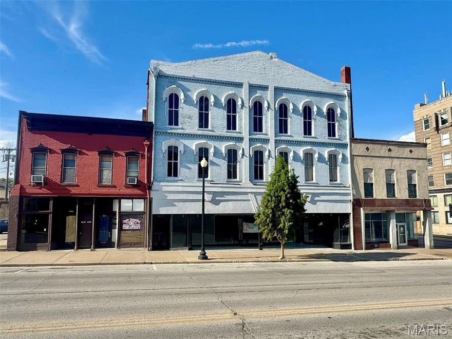 Downtown opportunity with immediate income! This attractive 3-story commercial building is located on bustling Broadway, offering high visibility & a prime spot in Hannibal’s growing downtown district. The exterior received a fresh facelift & offers a full-length, street-facing display window which draws in foot traffic & enhances curb appeal for all of downtown to see! The main level has been extensively renovated, featuring all new flooring, modern bathrooms, & an updated kitchen area; this floor is currently leased at $1,500/month, providing immediate ROI. The 2nd floor offers wide open space with a unique layout, beautiful views of the downtown area, & opportunity to craft it into whatever you see best fit! A secondary front entrance allows direct access to the upper levels without disrupting the 1st floor space, ideal for multi-tenant configurations or private office access. The 3rd floor offers space for storage & a 594sqft concrete loading dock can be purchased upon request!