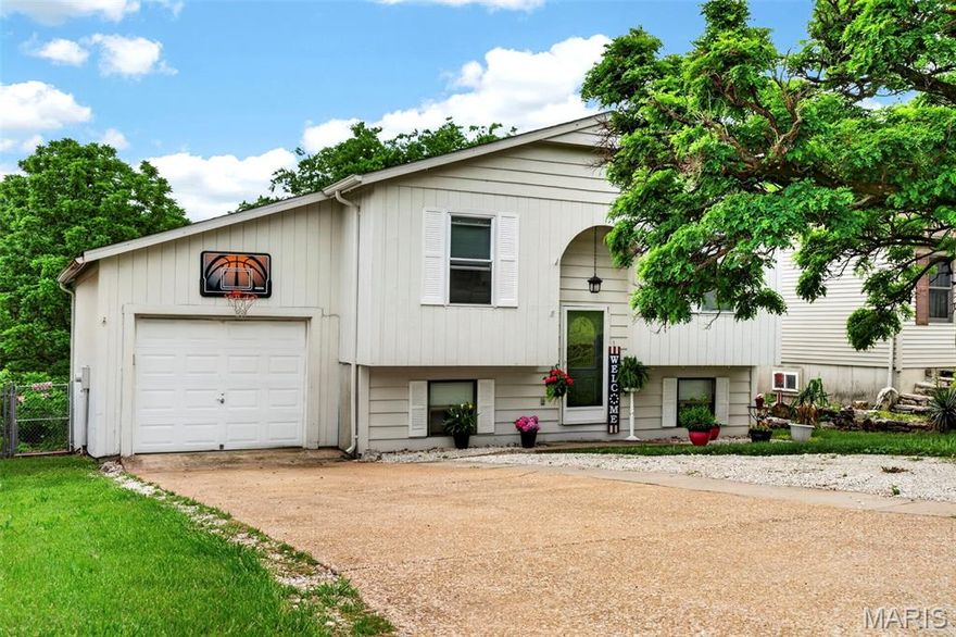 Beautifully updated 4-bedroom, 2 full bath split level home in the sought-after Seckman School District! The remodeled kitchen features white cabinetry, stainless steel appliances, and stylish laminate wood flooring. The main level offers a comfortable family room, 2 bedrooms, and an updated full bath with glass shower doors, white vanity, newer fixtures, faucet, toilet, and laminate flooring. The walk-out lower level includes 2 additional bedrooms/sleeping areas, a second full bath with walk-in shower and white vanity, plus a spacious family room perfect for relaxing or entertaining. Additional features include white 6-panel doors and trim, newer windows throughout most of the home, newer front and back doors, added central A/C, and HVAC approximately 6 years old. One-car garage. Private partially fenced backyard backs to trees for added privacy and a peaceful setting. Deck is being sold as-is. Great space, great updates, and a convenient Imperial location!