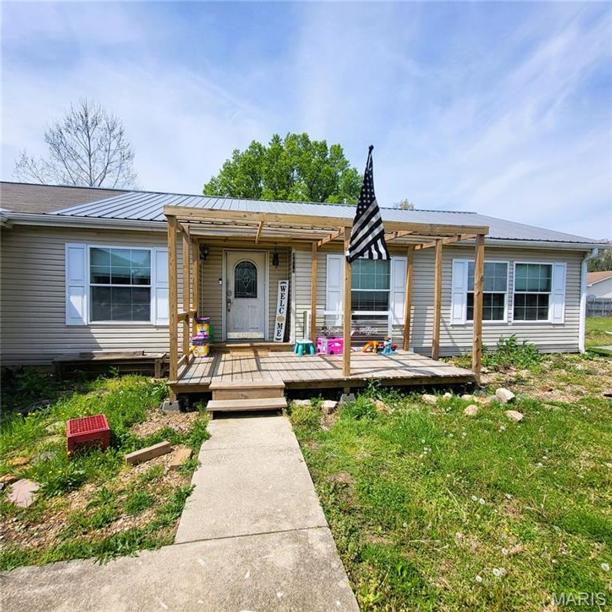 Welcome home to this spacious 1,906 sq ft, 3-bedroom, 2-bath property on the edge of town — complete with a dedicated office that can easily serve as a 4th bedroom. Built in 2007, this home offers modern construction paired with thoughtful updates throughout.

Inside, the bright, open living area features neutral paint, modern flooring, and abundant natural light. The kitchen flows seamlessly into the living room, creating an easy layout for gatherings and everyday living. All bedrooms are generously sized, and the primary suite includes a private bath with both a walk-in shower and a separate soaking tub.

Outside, the home sits on a level yard highlighted by a beautiful mature willow tree, offering shade, charm, and a peaceful outdoor setting. A brand-new metal roof is being added, giving buyers long-term durability and peace of mind. The 2-car garage adds convenience and storage, and the location provides the perfect balance — close to town amenities while still feeling private and relaxed.