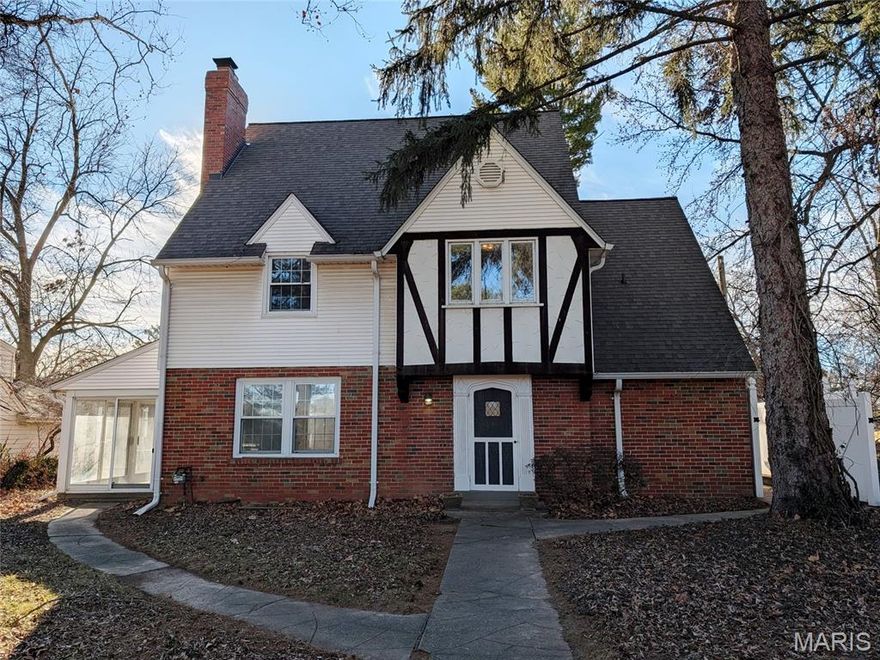 Spacious and open Tudor style home has so much to offer! Four levels of living with many upgrades! Sits on a private drive, with an enclosed rear porch, vinyl privacy fencing and an attached oversized garage. Special features include: Wood floors, granite counter tops, updated bathrooms, finished lower level, two fireplaces, ceiling fans and much more! There are four bedrooms, two full bathrooms and two half bathrooms. The house has been renovated previously and has damage that needs repairs prior to occupancy. Great opportunity, close to Lindenwood College, parks and theatre. Set your appointment today!