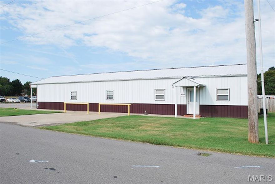 Are you searching for a commercial property located outside of the city limits of Dexter with ample opportunity for expansion?  This property currently has an office building (2016 square feet), a 1755 square foot machine shop, a 24 x 36 pole barn (864 square feet), 5-open bay garages (3160 square feet), and 3-open bay garages/also known as a 3-covered open/lean-to.  The office includes a front and side entrance.  If you enter the front (3 Mile Rd entrance, you have an entry with a receptionist office with a window separating the entry from the office area.  There are 3 additional offices and a restroom, in addition to the office in the entry.  A connecting ramp will lead you through a kitchen/breakroom area, to 2 large offices, another bathroom, storage, and a large conference/entry at the south end of the building.  This building is not included in the fenced area which houses the additional buildings and ample parking.  This is all located along Three Mile Road which is convenient to Highway 60 access.