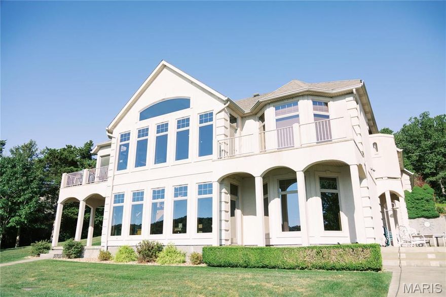 LUXURY WATERFRONT  ESTATE  ... Experience refined water front living in this elegant 3 BR, 4BA, residence with panoramic water views.  This open concept design features soaring ceilings, a gourmet chef's kitchen and expansive floor to ceiling windows.  Entertain on the spacious deck or enjoy tranquil evenings on your private dock.  IMPECCABLE finishes and breathtaking sunsets make this a rare waterfront retreat.