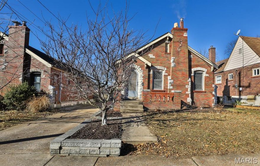 Charming brick bungalow in the heart of desirable University City, just minutes from some of St. Louis’ most beloved attractions—including The Loop, Clayton, Forest Park, the Zoo, museums, parks, and countless restaurants. With quick access to major highways, the location offers unbeatable convenience for work, school, and play.
This classic brick-and-stone home is filled with old-world character, highlighted by hardwood floors, arched doorways, and a beautiful stained-glass window. The main floor features two spacious bedrooms, a bright kitchen, dining room, and a welcoming living room anchored by an ornate stone gas fireplace. Step outside to a private, fully fenced yard with a patio—an ideal setting for relaxing or entertaining. The rare, oversized vinyl sided 2-car garage is an exceptional find in this area and price point. Additional amenities include new furnace & a/c(2025), Gutters(2024), Patio(2022),  Fence(2025) and a 200 amp electric panel. 
Priced to allow for your updating while still offering tremendous value, this home presents a wonderful opportunity to make it your own. Don’t miss this rare chance to own a University City gem!