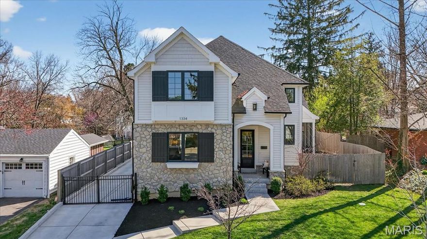 Welcome to this thoughtfully crafted, three-year-old residence nestled in the heart of sought-after Glendale. From the moment you arrive, the home’s charming exterior sets a welcoming tone.

Inside, white oak floors, soaring ceilings, and refined millwork create an immediate sense of quality. Just off the entry, a well-appointed powder room you will pass on your way to the main living space. The hearth room features a box beam ceiling, expansive windows that fill the space with natural light, and a striking stone fireplace. Plenty of area for visiting, plus a built-in beverage bar and adjoining screened porch make this area ideal for entertaining while seamlessly extending the living space outdoors.

The kitchen is both stylish and functional, anchored by an oversized island and equipped with stainless steel appliances, a walk-in pantry, and custom cabinetry. Ample seating at the island and an adjacent dining area provide flexibility for everyday living and gatherings. A conveniently located laundry and mudroom sit just off the kitchen.

The main-floor primary suite offers a private retreat, highlighted by a spacious bedroom with a shiplap coffered ceiling and carefully curated finishes throughout. Dual walk-in closets lead to a well-designed bath featuring separate vanities, a generous shower, and a soaking tub.

Upstairs, three generously sized bedrooms each include walk-in closets. Two share a hall bath with a double vanity, while the third features its own en suite bath.

The finished lower level expands the home’s versatility with durable LVP flooring, a large recreation area, a fifth bedroom, and a full bath. Additional storage space presents an opportunity for a home gym, indoor play area, or other customized use.

Outdoors, the fully fenced backyard is complete with turf, a patio, and plenty of room to scoot around or play basketball. A two-car garage and electric gate add convenience and privacy.  A ideal location, walkable to schools, parks and much more!