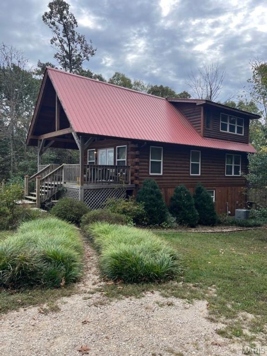 4 bedroom log home located on 5.62 heavily wooded acres only about a mile from the Scott's Ford public access to the upper Meramec River. You will also only be about 5 miles from historic Steelville, Meramec Springs park trout hatchery and nearby wineries. The log homes boasts basement rooms Income potential.
