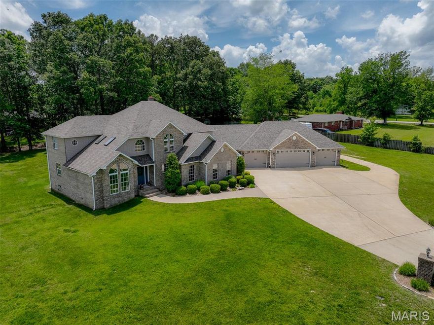 Stunning 5 bed, 5 bath home with 4 car garage on 1.67 acres (m/l). Sits quietly with just a few neighbors and overlooking the lake at the end of the lane. Just off Township Line Road, but with almost no traffic. Walk through the front door to a nice living room and beautiful staircase, but we'll get back to that! Ahead of  you is a gorgeous dining room, leading to one of the sharpest kitchens you'll find anywhere. Amazing custom cabinets, stainless appliances, huge pantry, and even a wood burning fireplace. As you make your way through the house, you'll find the first living area of the home which includes a large primary bedroom with terrific bath and a family room to die for...you have to see it! Getting back to that staircase which takes you to a second large bedroom with adjoining bath and sitting area and three more bedrooms and another full bath. The home encompasses more than 4650 square feet of comfortable, stylish living. Perfect for large families, multi-generational families, or just someone who wants lots of space and comfort. Enjoy the brand new vinyl fence and the bass fishing in the private community lake next door!