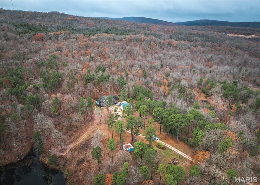 Discover Missouri living with this stunning 4-bedroom, 2.5-bath, 3,200+ sq.ft. log cabin situated on 123 m/l acres of wooded land. This impressive two-story home blends rustic charm with expansive space, offering a warm lodge-style atmosphere and plenty of room for family, guests, or entertaining. Step outside and enjoy the incredible recreation opportunities this property provides. This property hosts a heathy population of whitetail deer and turkey, it’s a hunter’s paradise. The land features rolling timber and trails, perfect for exploring, hiking, riding, or simply enjoying the peace of nature. Just a short walk from the home sits a private stocked lake, offering a great place to relax, fish, or take in the sunset. A 2-bay shop provides excellent storage for equipment or UTVs, and can easily serve as a workspace or parking area. Whether you’re seeking a private getaway, a hunting retreat, or a full-time home surrounded by nature, this property delivers the space, seclusion, and beauty you’ve been looking for. Property is located approximately 5 miles from St. Joe State Park and just over an hour from St. Louis.