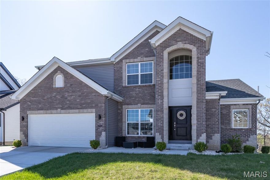 Stunning 2-year-old home with soaring 19-ft ceilings and a wall of windows in the living room. Hardwood floors throughout main areas and upper hall. Chef’s kitchen with quartz waterfall island, 42" soft-close cabinets, gas range, and walk-in pantry. Main-level primary suite plus 3 more bedrooms and 4 baths total. Walkout basement ready to finish. Relax on the deck or patio overlooking peaceful woods. Plus New roof, siding, gutters, driveway, and radon system. All appliances stay! Friendly neighbors and a warm, welcoming community.