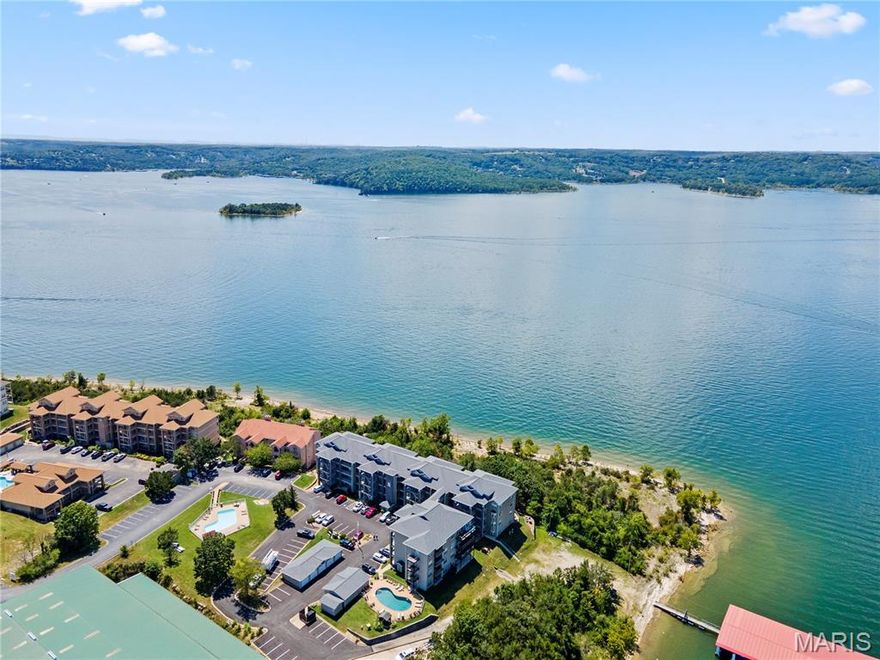 Experience Elevated Lake Living at Its Finest on the Shores of Table Rock Lake! GORGEOUS, LAKE FRONT CONDO with the MOST BREATHTAKING, Panoramic Table Rock Lake Views Stretching Across Sparkling Waters & Painted Skies, the Most SPECTACULAR Sunsets Every Evening! It Would be Almost Impossible to Find Table Rock Living This Close to the Water Anywhere Else. Awake Every Morning to the Sound of Waves Crashing Against the Shore! Enjoy the Lake Upfront & Personal From the Comfort of Your Home. Watch the Boats, From Early Morning Fishers to Tubing/Surfing Into the Sunset. You're in For a Real Treat When the Showboat Cruises by the Condo, a Majestic Site to Behold. IT GETS EVEN BETTER, This is an Active, TurnKey Nightly Rental w Great Rental History, Being Sold Fully Furnished. Perfect for Full Time Living, Vacation Home and/or Investment. Well-Appointed Kitchen w Granite, Beautiful Backsplash & Stainless Appliances, Cozy Stone Woodburning Fireplace, Incredible Lake View From Primary Bedroom & Living Room. Separate Laundry Room w Full Size Washer & Dryer. Lake Harbour is an Intimate Building, Only 16 Units, w It's Own Salt Water Pool, So Never a Crowd Issue. Walk Out Your Door & You're Steps from the Shore, Featuring a Gravel Swim Beach. Walk the Shoreline Forever. Every Evening You are in for an Amazing Sunset Display. The Stars are Just Breathtaking Viewed From the Balcony! Spot Eagles, Herons & a Variety of Waterfowl & Birds All Year Long. Emerald Pointe is a Luxury Gated Community w Quick Hwy Access, Short Drive to Shopping, Dining, Attractions, Medical, Championship Golf Courses, etc. Incredible Community Amenities Include Clubhouse, Pool, Pickleball/Basketball/Tennis Court, Marina w High & Dry Storage, Courtesy Dock, Boat Ramp, Secure/Gated Storage & LakeFront Access.