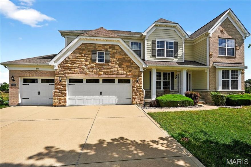 Tucked at the end of a friendly cul-de-sac in the Estates at Town & Country Crossing, this inviting home w/ 5-bed, 4.5-bath, 3-car attached garage blends neighborhood charm with ‘close-to-everything’ convenience. Inside, gleaming hardwood flooring invites through the home; The foyer is flanked by a formal dining room & flexible front room (office or living room). The heart of the home is the 2-story great room w/ stone woodburning fireplace, open to a chef’s kitchen w/ custom cabinetry, granite counters, center island w/ breakfast bar, gas cooktop, vented hood, wall oven/microwave, & walk-in pantry. Meals flow from the breakfast room into a four-season sunroom & out to the deck overlooking the level yard. Daily life runs smoothly w/ a butler pantry, mudroom, main-floor laundry room w/ dedicated sink, & a powder room. Upstairs, the primary suite offers a tray ceiling, walk-in closet, &  ensuite w/ double vanity, whirlpool tub, & oversized shower. 3 additional bedrooms include a Jack-and-Jill plus a hall bath, & a sitting area adding a lounge or homework space. The finished, walk-out lower level is built to gather w/ an expansive recreation area, media/theater space, billiards, gym zone, 5th bedroom w/ adjacent full bath, & storage space. Peaceful & private backyard w/ playground and composite deck has adjoining trees to complete the picture. Live close to everything you love in West St. Louis County—then come home to calm.
