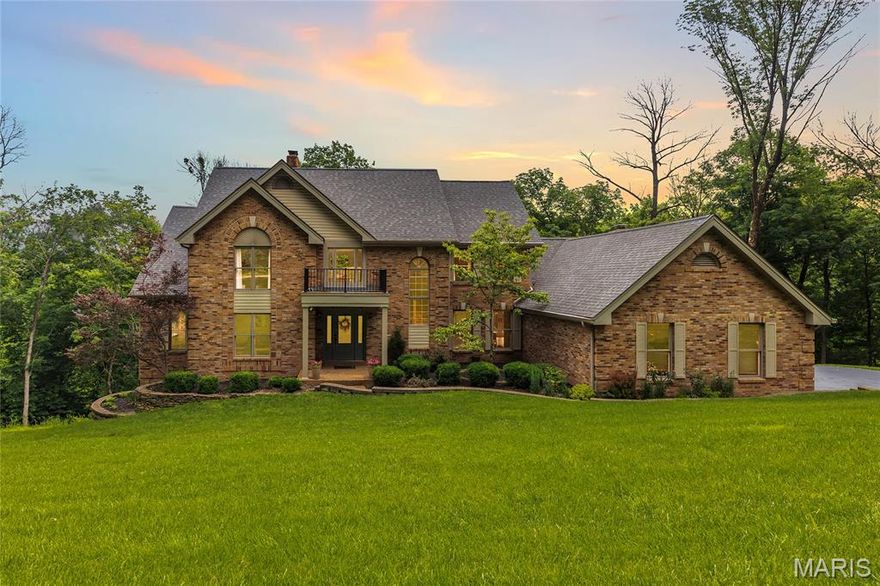 Back on Market - No Fault of Seller! Stunning, custom renovation situated on a beautiful 3.2+ acre secluded lot in the heart of Wildwood. This home features 5 bedrooms, 4.5 bathrooms and over 5,000 square feet of living space. Attention to detail and custom features abound. Enjoy the views from the 2-story great room with atrium staircase and wall of windows to the lower level. The kitchen includes a Bosch convection cooktop, Quartz countertops, large center island, coffee bar, double wall ovens and ample cabinet space. Main floor primary suite boasts a spacious vaulted sleeping space with powered window shades, custom walk-in closet and gorgeous en suite bath featuring dual adult-height sinks with wall-mounted faucets, custom stone and tile shower and freestanding soaking tub. Upstairs, find 3 spacious bedrooms; 2 share a Jack and Jill bath and the third is a private en suite. A fifth bedroom is located in the walkout lower level, along with a full bath, wet bar and spacious entertaining space. Enjoy views from the dual level, newer (2022) maintenance-free deck, which spans a large portion of the rear of the home. Additional features include a newer roof (2022), newer engineered hardwood floors and carpet throughout (2022), zoned HVAC, soaring vaults and skylights and custom fireplace finishes. Enjoy the privacy of this subdivision and acreage, but just minutes to Chesterfield Valley's shops and restaurants. Award-winning Rockwood schools!