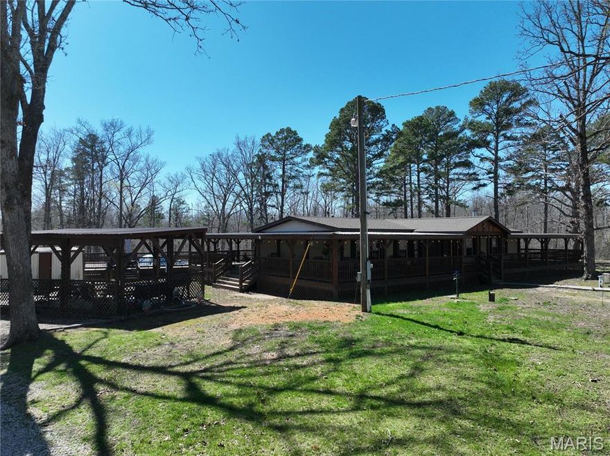 Beautiful, well-maintained 3 bed, 2 bath home with wrap-around covered deck, 3 bay shop with lean-to, above-ground pool, large pavilion area, storm shelter, shop and double carport on 16 m/l acres. The home has a semi-open, split bedroom floor plan, coordinating stone work, archways and pillars throughout. The primary bedroom suite has a massive 14' x 9' closet, soaking tub, double vanity and full size shower. The living room features a functional wood burning fireplace with an electric insert. Walk into the dining room through decorative stone pillars and then out through sliding glass doors to your covered deck. The kitchen has stainless steel appliances, pantry and an island with stone accents. One section of the shop is 52'x24' with 16' sidewalls and lift master roll up doors and the other side is 40' x 30' with 10' sidewalls and a half bath. Enjoying the outdoors on this prime piece of land is easy with a 15'x30' pavilion, 27' pool, over 2,000 sq ft of covered deck space and 16 wooded acres. This property is only 10-20 minutes from each of the following: Current River in Van Buren, Clearwater Lake in Piedmont and Black River in Ellington. This custom 2010 Deer Valley manufactured home has all the upgrades from drywall to flooring, fixtures, siding, added insulation, 2x6 studs, block foundation and more! The home has a wired CC surveillance system with phone monitoring, fiber-optic internet available, it is all electric, has optional external wood stove heat source and on it's own well and lagoon. New roof on house, shop and covered areas in 2025. This place is extraordinary and was built to last, call to schedule your showing today! 960 Hwy 34, Van Buren, $349,900.