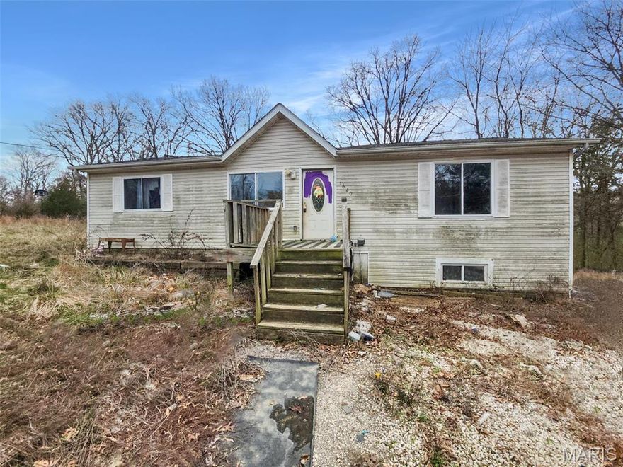 This charming 3-bedroom, 2-bathroom ranch-style home offers approximately 1,104 square feet of living space characterized by an inviting open-concept floor plan, alongside a full, partially finished walk-out basement that provides potential for a workshop or additional storage. Step outside to enjoy the serene, wooded surroundings from the private deck or covered porch, with the added benefit of lake access and a level lot that backs to a tranquil treeline. Situated in a quiet cul-de-sac with ample oversized parking and a shed for outdoor equipment, this home blends a traditional architectural feel with the convenience of modern maintenance-free vinyl siding.