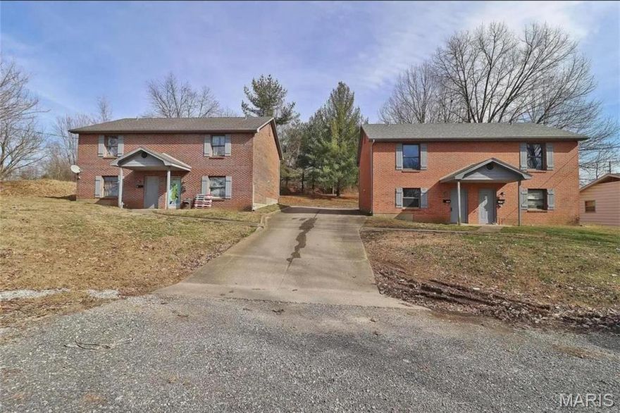 Two duplexes offered as a package, totaling four units. Each unit features 2 bedrooms and 1.5 bathrooms with a functional two-story layout—living spaces on the main level and bedrooms upstairs. Units include standard kitchens, in-unit laundry hookups, and parking areas.